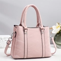 Pink faux leather tote bag with marble texture and silver rivets for stylish women - Pink