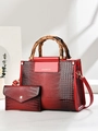 Detail of red and black gradient handbag set with bamboo handle and crocodile texture - Wine Red