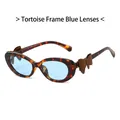Schildpad cat-eye zonnebril met blauwe glazen en bruine strik aan de zijkant - Schildpad Frame Blauwe Lenzen