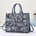 Detail of grey-blue floral embroidery on tote bag with GIANRUTSR logo and leather handles - Blue