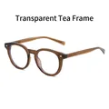Retro round TR90 glasses in transparent tea frame with elegant rivet details - Transparent Tea