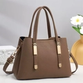 Brown lychee leather tote bag with gold hardware and adjustable strap in 45-degree view - Khaki