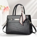 Elegant black crocodile embossed tote bag with glossy finish and decorative silk scarf - Black