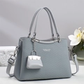 Detail of grey woven crossbody bag with silver hardware and mini pouch charm decoration - Blue