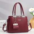 Elegant burgundy litchi grain handbag for women with silver logo and adjustable shoulder strap - Red