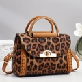 Chic leopard print crossbody bag with gold twist lock and woven leather side details - Khaki/Earth Yellow