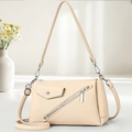 Minimalist beige crossbody hobo bag with diagonal zipper and faux leather texture - Light Khaki