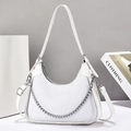 Detail of white hobo bag with textured leather, silver metal chain, and zip closure - White