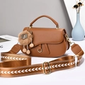 Caramel saddle shoulder bag with wide woven strap and cute plush animal keychain charm - Caramel color
