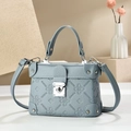 Gray-blue leather crossbody bag with floral embossing and silver twist lock closure - Blue