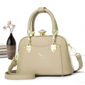 Detail of light beige tote bag featuring a crystal knob closure and elegant top handle - Green