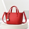 Chic red faux leather tote bag with silver lock detail and classic embossed lettering - Red