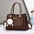 Deep brown monogram tote bag with gold logo, adjustable strap and plush eye charm - Coffee