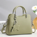 Elegant pistachio green pebbled leather tote bag with star charm and silver hardware - Green
