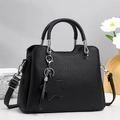 Classic black leather tote bag with top handles and adjustable shoulder strap for women - Black