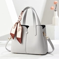 Minimalist light grey lychee textured handbag with silk scarf and crossbody strap - Gray