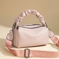 Pink lychee leather crossbody bag with cloud pleated handle and branded strap - Pink