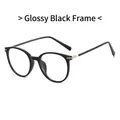Glänzend schwarze ovale Brille mit feinen silbernen Metallakzenten an den Bügeln - Glänzender schwarzer Rahmen