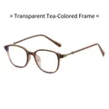 Occhiali tondi color tè traslucido con decorazioni floreali metalliche sulle aste - Tè Trasparente