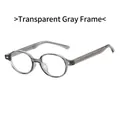 Occhiali rotondi retrò in TR90 grigio trasparente con eleganti dettagli in metallo - Grigio Trasparente