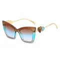 Occhiali da sole cat-eye classici con lenti sfumate blu e dettaglio a cuore in metallo oro - Montatura Te Blu Lenti Te Blu