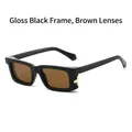 Quadratische Sonnenbrille in Schwarz mit braunen Gläsern und goldenem Blumendetail - Glänzend schwarzer Rahmen Teegläser