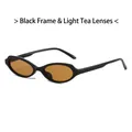 Gafas de sol ovaladas con montura negra y lentes color té para un estilo retro - Marco Negro Lentes de Té Claro