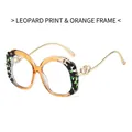 Fashionable amber orange and leopard print eyewear frame with golden heart temples - Leopard Orange Frame Clear Lens