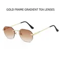 Occhiali da sole rimless ottagonali con stanghette dorate e lenti marroni sfumate - Montatura Oro Lente Tè Sfumata