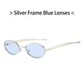 Occhiali da sole ovali retrò con montatura argento e lenti blu per un look vintage - Montatura Argento Lente Blu