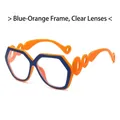 Fashion geometric sunglasses with blue and orange frames and hollow wavy temples - Blue Orange Frame Clear Lens