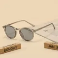 Transparent grey TR90 sunglasses with dark grey lenses in a classic round frame style - Translucent Grey Frame Grey Lens