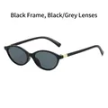 Sleek oval black frame sunglasses with dark grey lenses and gold accent detailing - Black Frame Black Grey Lens