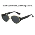 Moderne Katzenaugen-Sonnenbrille mit schwarz-goldenen Rahmen und goldenem H-Detail - Schwarz Gold Rahmen Schwarz Grau Gläser
