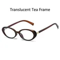 Vintage oval small frame sunglasses in transparent tea finish with gold hinge details - Translucent Tea Frame Clear Lens