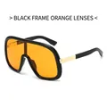 Fashionable black frame sunglasses with bright orange lenses and gold metal details - Black Frame Orange Lens