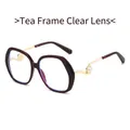 Brown oversized retro glasses with gold metal temples and elegant white pearl accents - Tea Frame Clear Lens