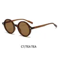 Lunettes de soleil Y2K ovales rétro avec monture et verres thé transparents, vue de profil - Monture Thé Transparente Verres Thé