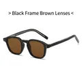 Classic retro sunglasses featuring a black frame and tea-colored lenses with metal rivets - Black Frame Tea Lens