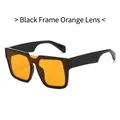 Trendy zonnebril met dik zwart montuur en oranje glazen voor een stijlvolle look - Zwart Frame Oranje Glazen