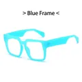 Retro oversized square sunglasses featuring a vibrant blue frame with a trendy aesthetic - Blue Frame Clear Lens