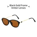 Fashion cat-eye sunglasses featuring black and gold frames with brown tea lenses - Black Frame Tea Lens