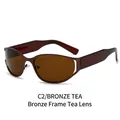Y2K oval cutout metal sunglasses featuring bronze frames and tea tinted lenses - Bronze Frame Brown Lens