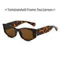 Occhiali da sole geometrici cat eye tartarugati con lenti color tè e aste larghe - Montatura Tartarugata Lente Tè