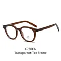 Oval anti-blue light glasses with transparent tea frame and UV 400 protection lens - Transparent Tea