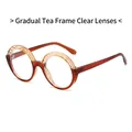 Stylish round-frame sunglasses featuring gradient brown frames and clear lenses - Gradient Tea Frame Clear Lens