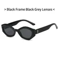 Gafas de sol ojo de gato negras con montura poligonal y detalles de rombos dorados - Montura Negra Lentes Gris Negro