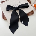 Elegant black chiffon hair scarf with woven label tied on a wooden tray for styling - 19 Tie-Solid Black