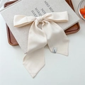 Creamy white satin bow hair scarf with smooth texture displayed on a wooden tray - 20 Tie-Solid Beige