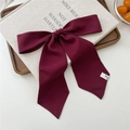 Deep red vintage bow hair scarf tied with flowing ribbons on a rustic textured surface - 21 Tie-Solid Wine Red